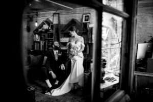 Photographer capturing candid wedding moment in church