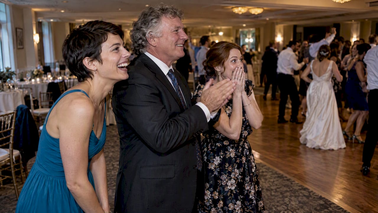 Wedding guests reacting beside dance floor